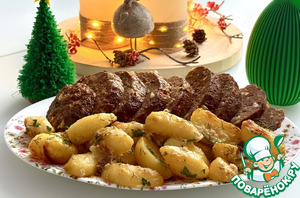 Мясной хлебец в окружении ломтиков картофеля